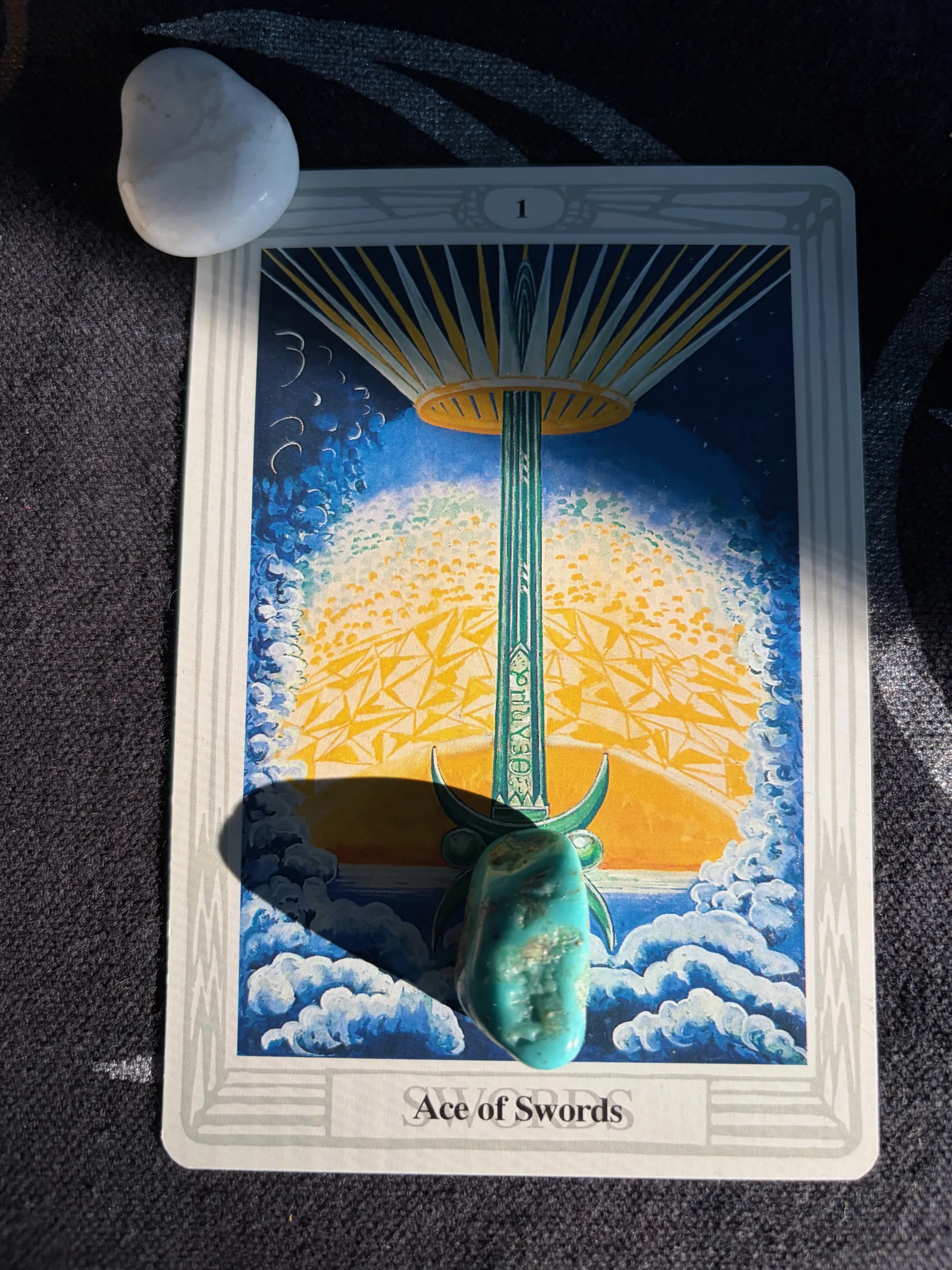 A majestic upright sword piercing a crown, symbolizing mental clarity and breakthrough ideas from the Ace of Swords tarot card.